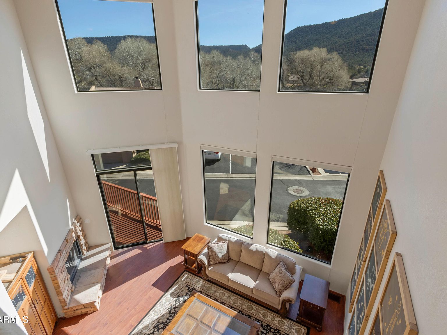 The double-height great room and its hillside view