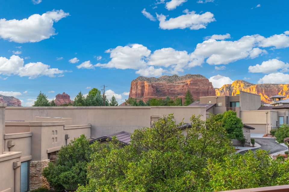Red rocks beyond the rooftops