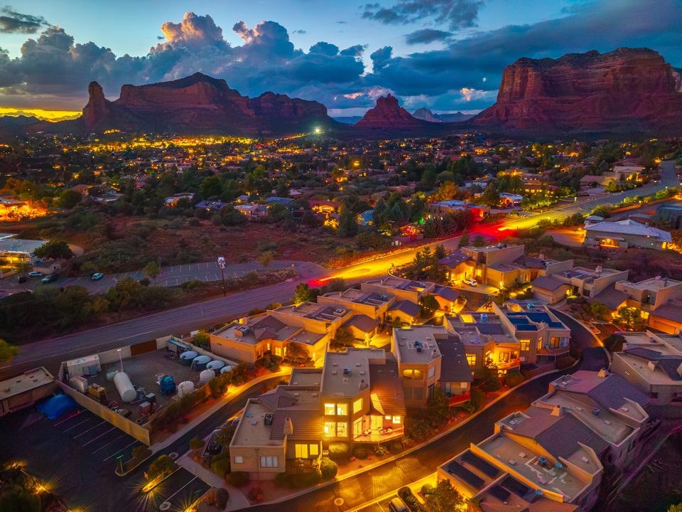 Red-rock silhouettes at twilight · Aerial photograph