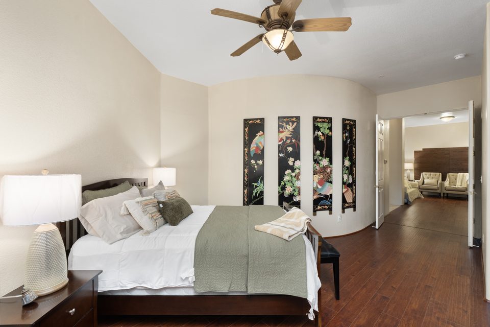 An ensuite bedroom with a calm, restful palette