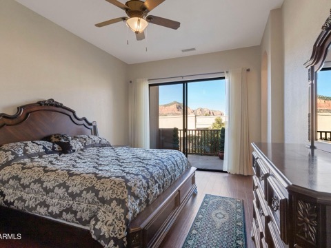A bedroom with red rock views