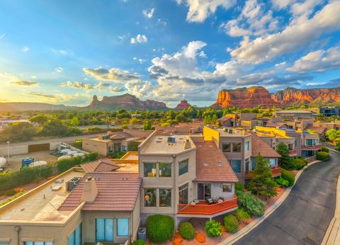 The home with Sedona’s red rocks beyond · Aerial photograph