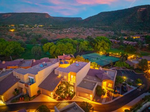 The home and hillside at dusk · Aerial photograph
