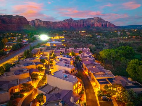 Evening lights across the neighborhood · Aerial photograph